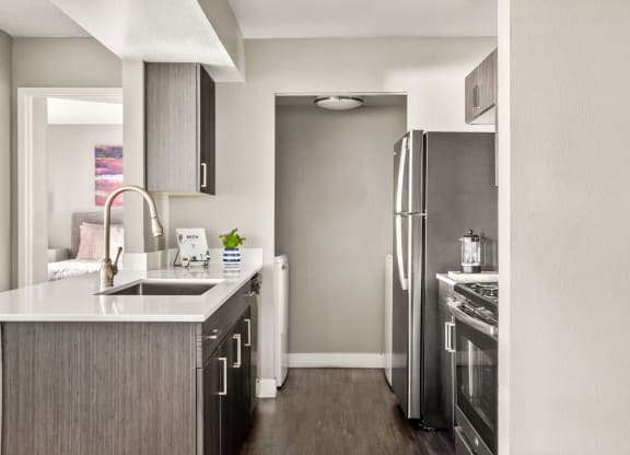 a kitchen in a 555 waverly unit with stainless steel appliances